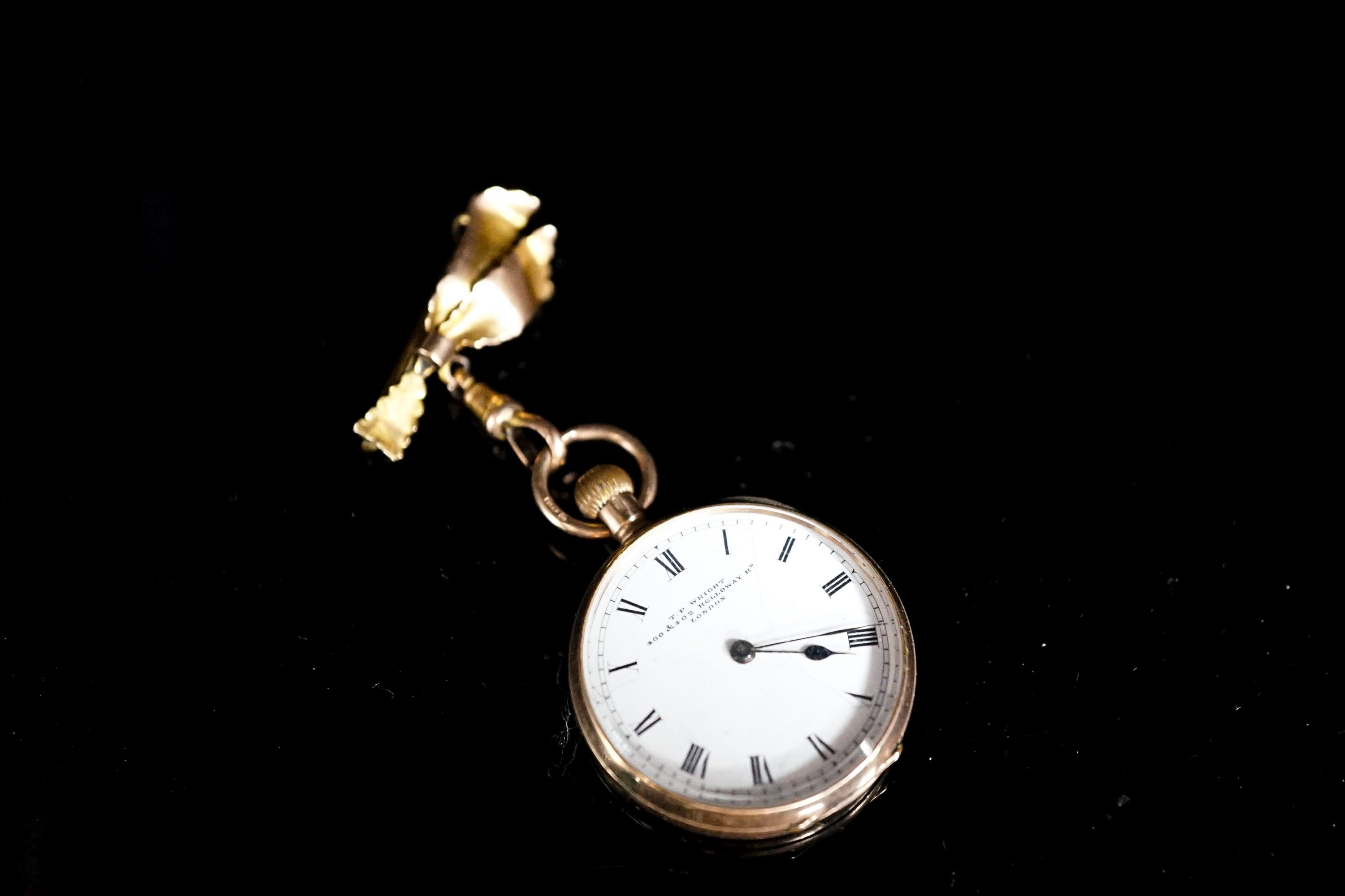 An early 20th century 9ct gold open faced fob watch, case diameter 30mm, on a 9ct suspension brooch, gross weight 26.4 grams.